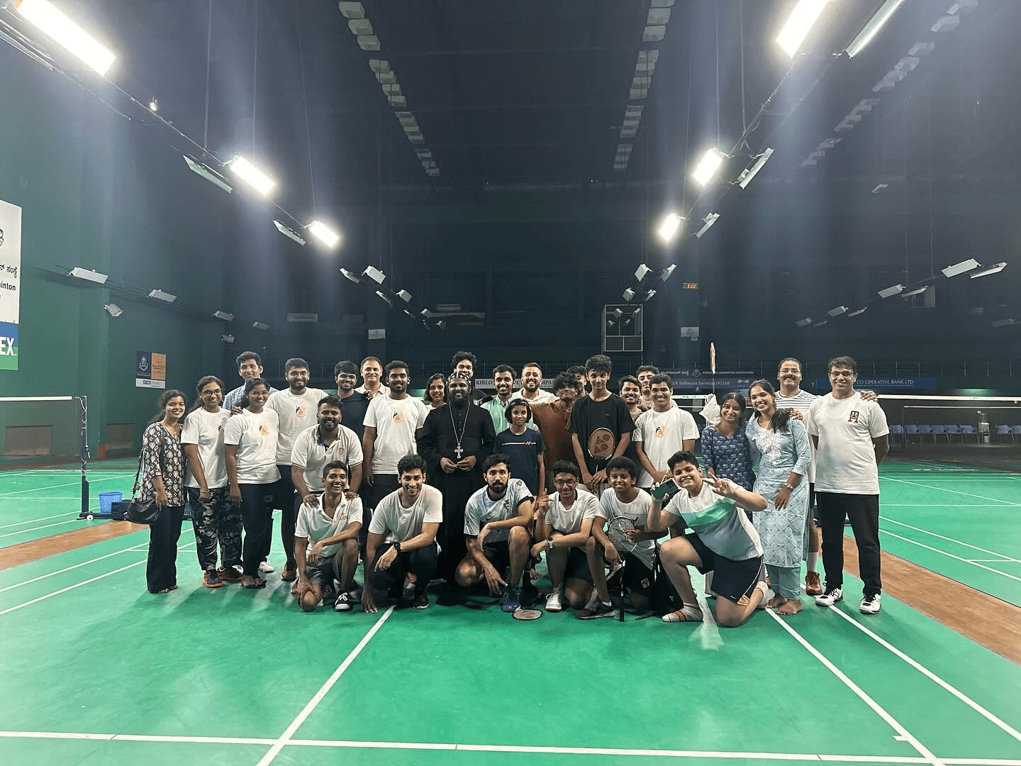 Parishioners and clergy together for a friendly badminton meet